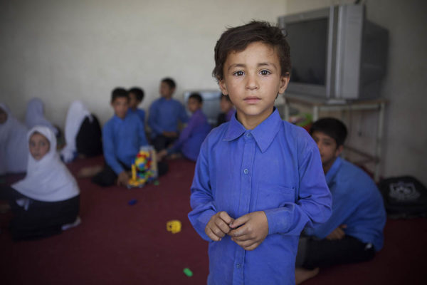 Bilal, 5, a deaf and mute Afghan child looks on as he attends an orientation class at the National deaf school on the eastern outskirts of the capital Kabul, on June 21, 2017.